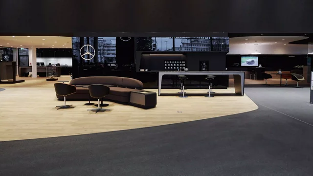 Modern lounge features brown furniture in a sleek, stylish showroom setting