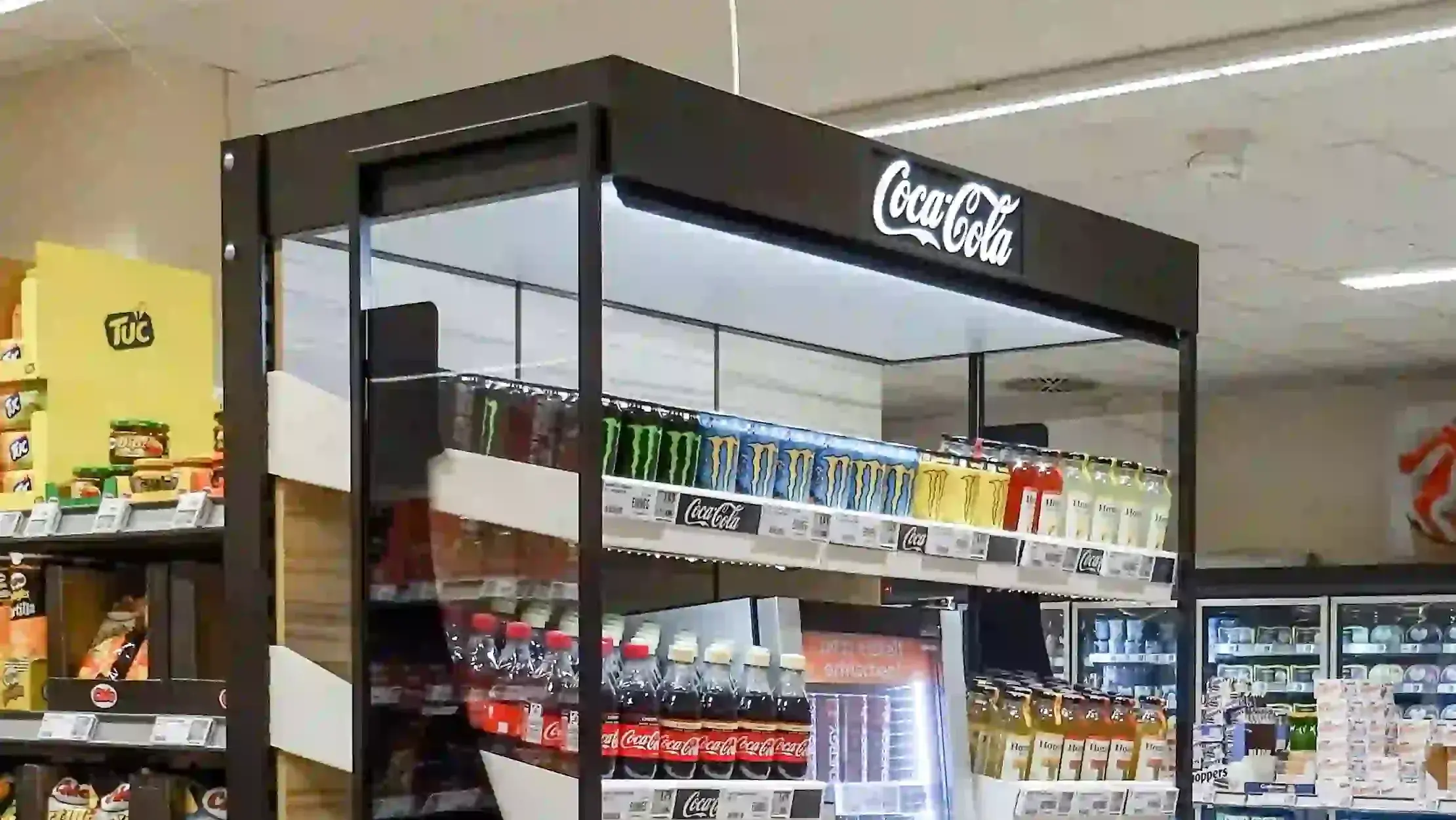 Coca-Cola display showcasing beverages in supermarket