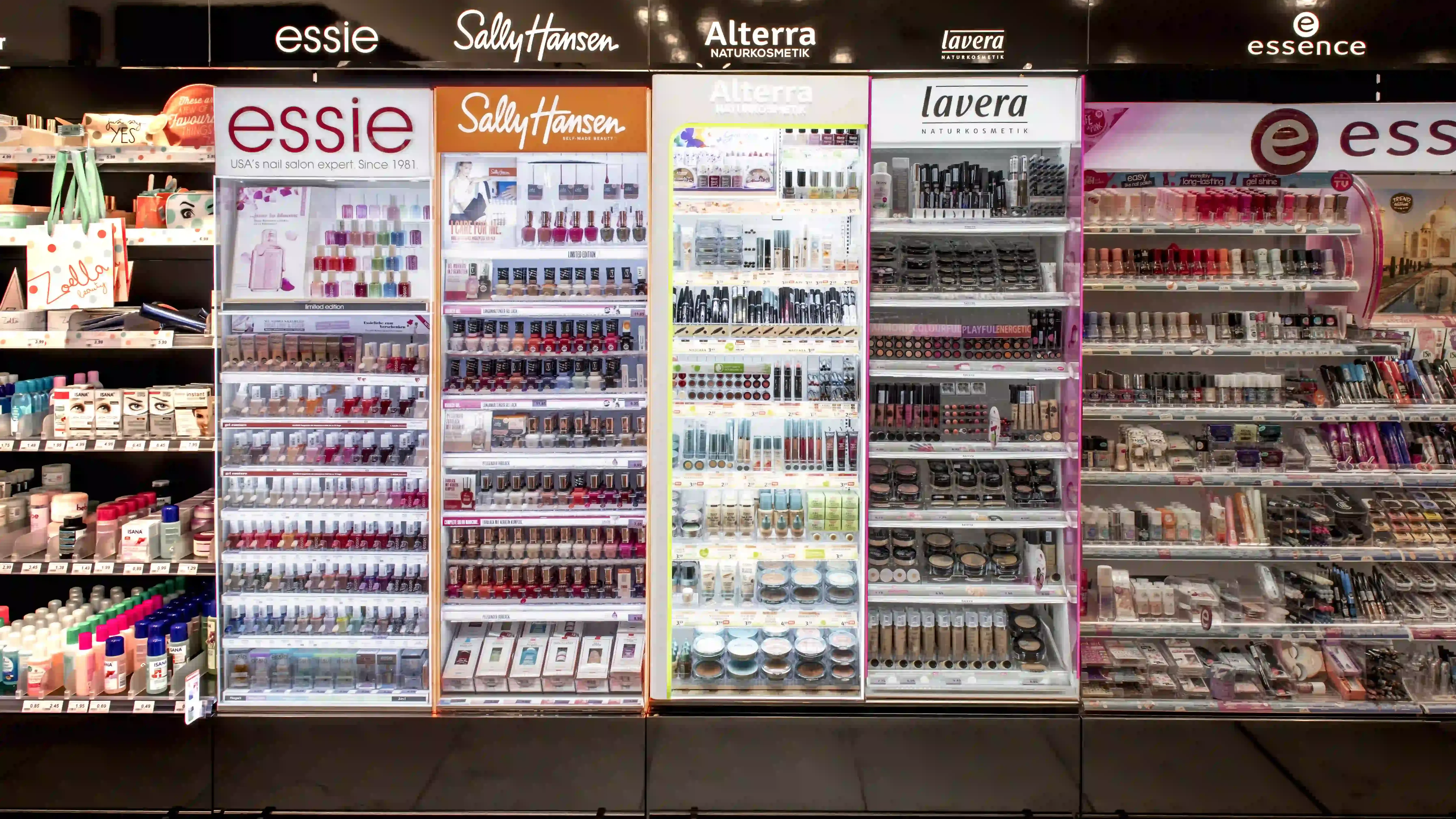 Cosmetics displayed on shelves in a brightly lit store