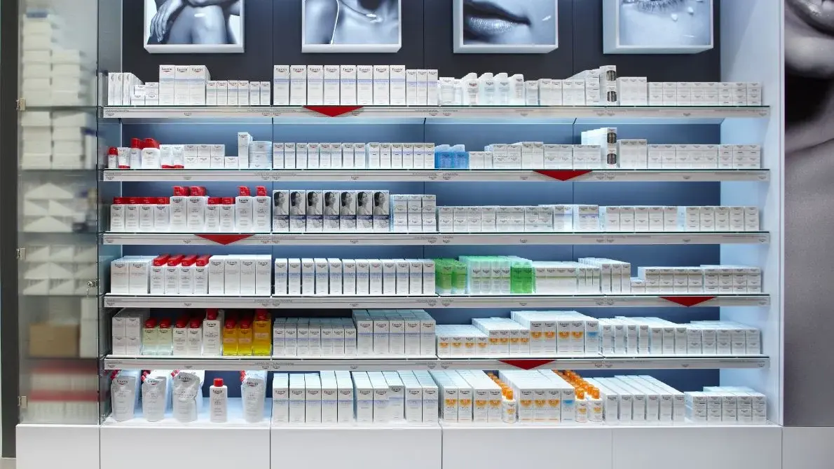 Skincare products neatly arranged on shelves in a bright retail display