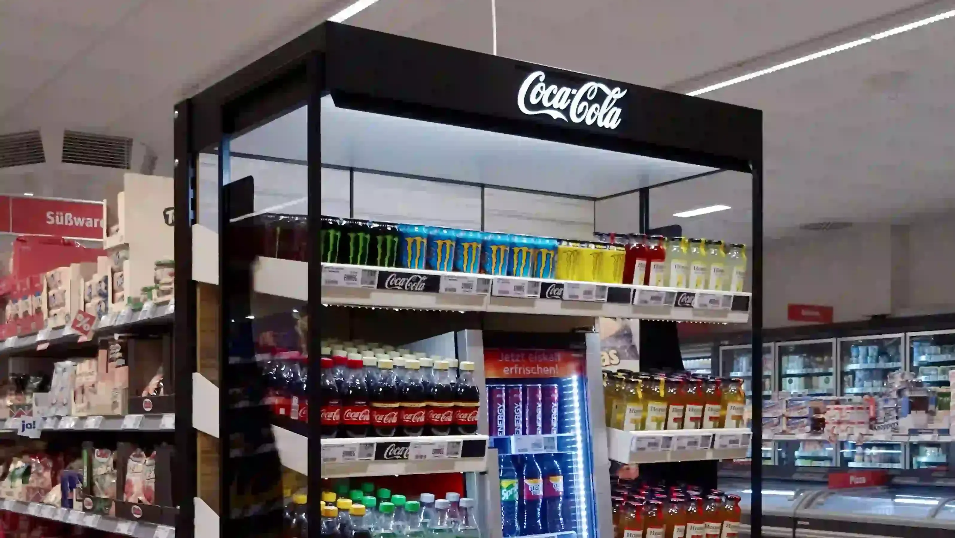 Coca-Cola display unit showcases beverages in supermarket