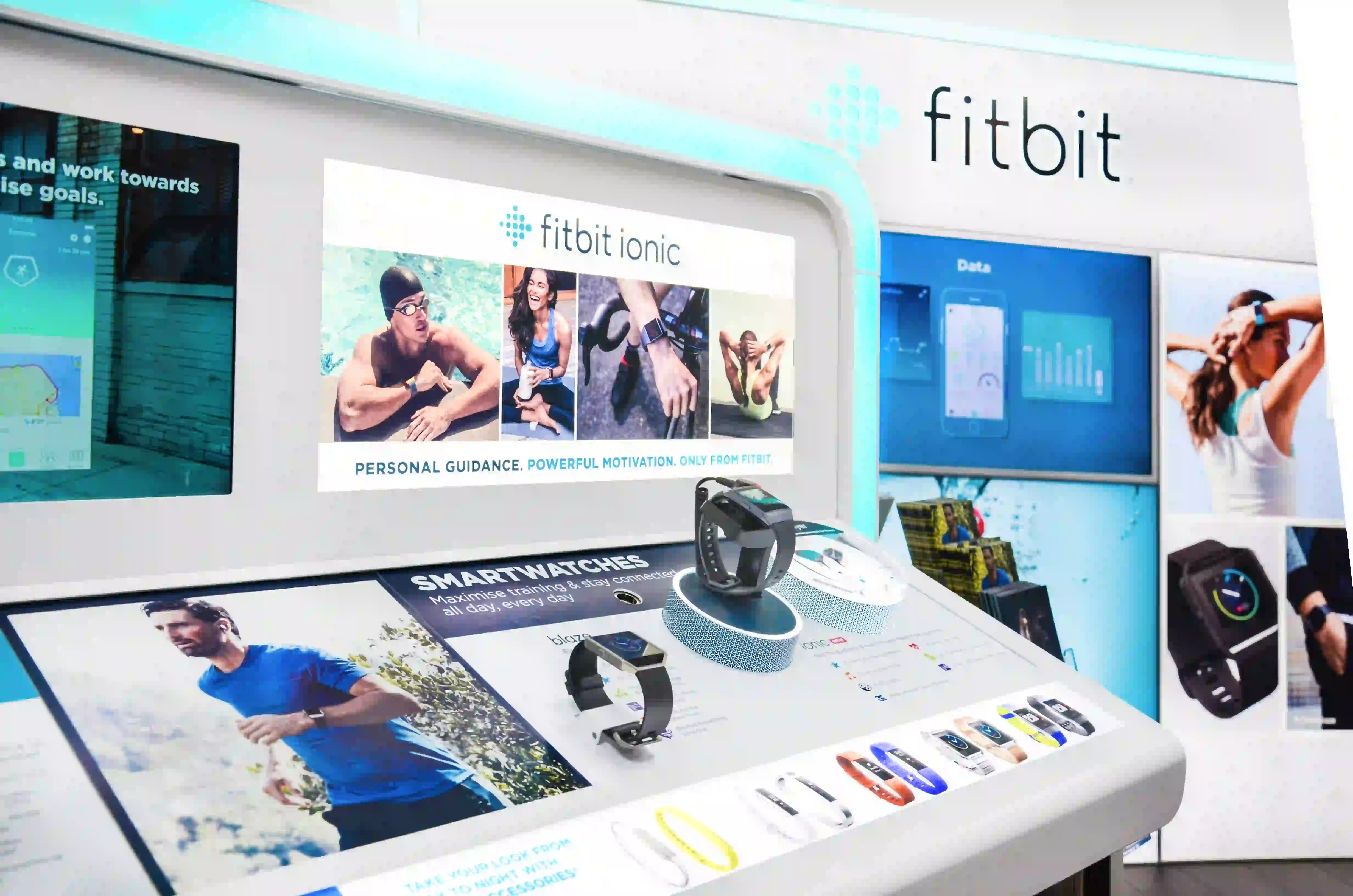 Fitbit smartwatches displayed in retail store